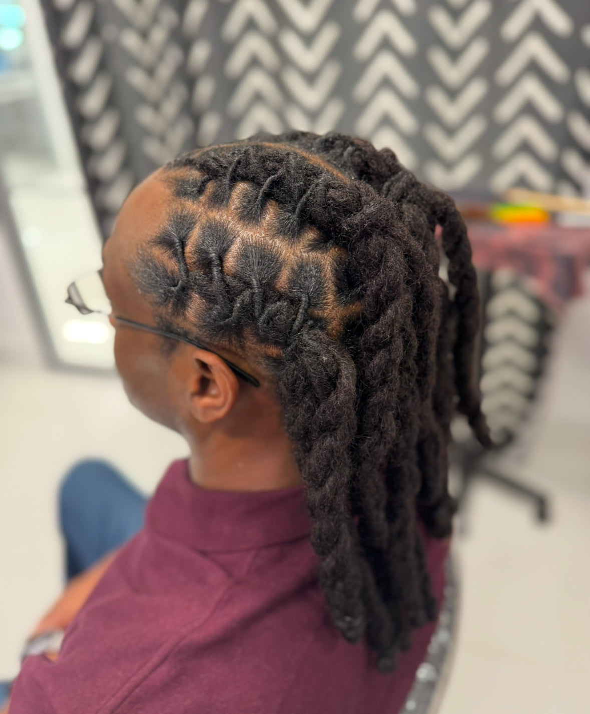 The Truth About Retwisting Locs: How Often Should You Really Do It?