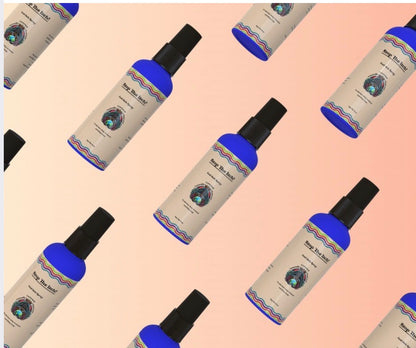 Pattern of Stop the Itch 4 oz scalp spray bottles with current Naturally Crowned Universe labels